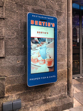 Outdoor LCD display by Add Vision showing vibrant digital signage in an outdoor setting
