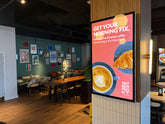 Slimline Pro advertising display by Add Vision showing a sleek, modern digital signage setup with vibrant visuals and a slim profile.