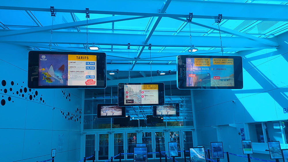 Outdoor LCD display by Add Vision showing advertising content in an outdoor environment with weather-resistant casing