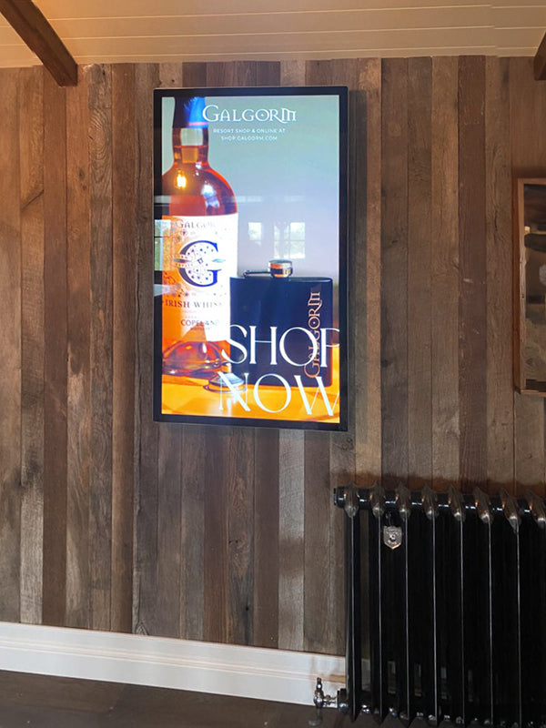 Slimline Pro advertising display by Add Vision showing digital signage with vibrant graphics and sleek design.
