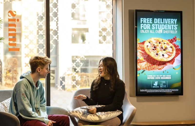 Add Vision Slimline Pro advertising display showing a sleek, modern digital signage setup with vibrant visuals.