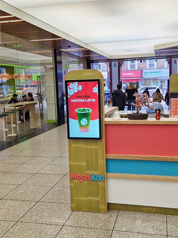 Slimline Pro advertising display by Add Vision showing vibrant digital graphics and sleek design in a professional setting.