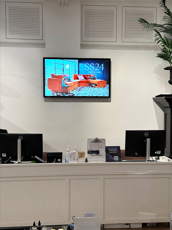Slimline Pro advertising display by Add Vision showing digital signage with vibrant content on a sleek, modern screen.