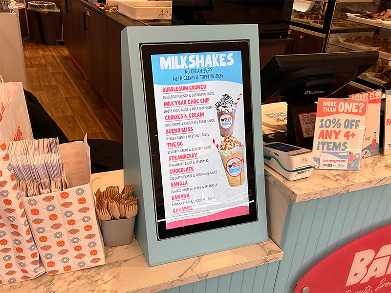 Slimline Pro advertising display by Add Vision showcasing a sleek, modern digital signage solution with vibrant screen content.