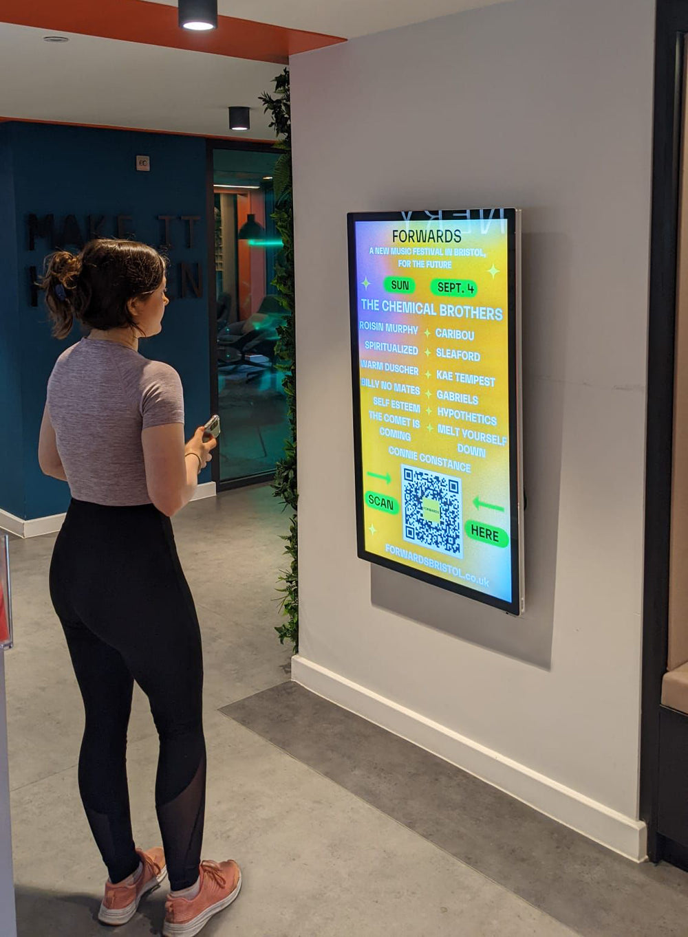 Slimline Pro advertising display by Add Vision showing digital signage mounted on a sleek, modern frame in a professional setting.