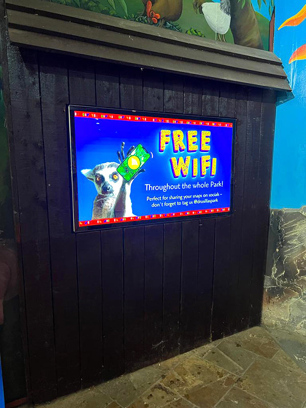 Slimline Pro advertising display by Add Vision showcasing a sleek, modern digital signage setup with vibrant screen content.