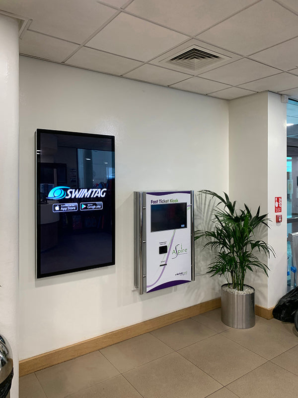 Slimline Pro advertising display by Add Vision showing a sleek, modern digital signage setup in a professional environment.