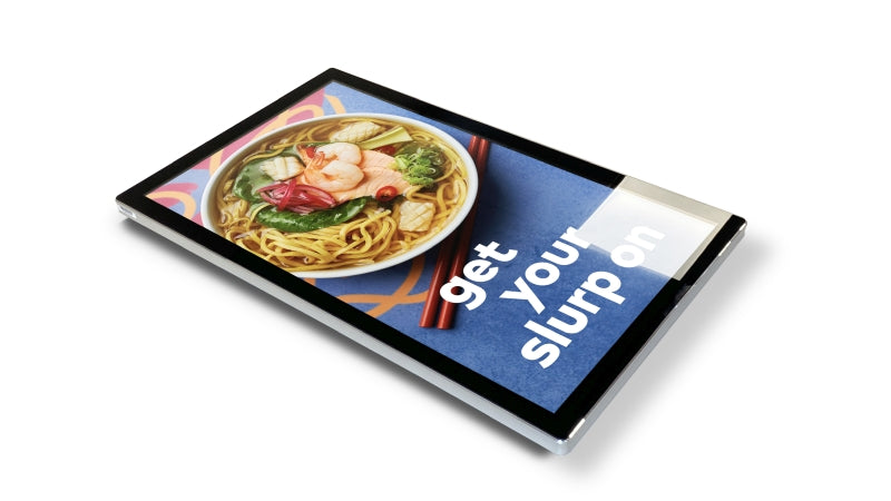 Add Vision Slimline Pro advertising display with sleek white frame, showcasing digital signage on a clean white background.