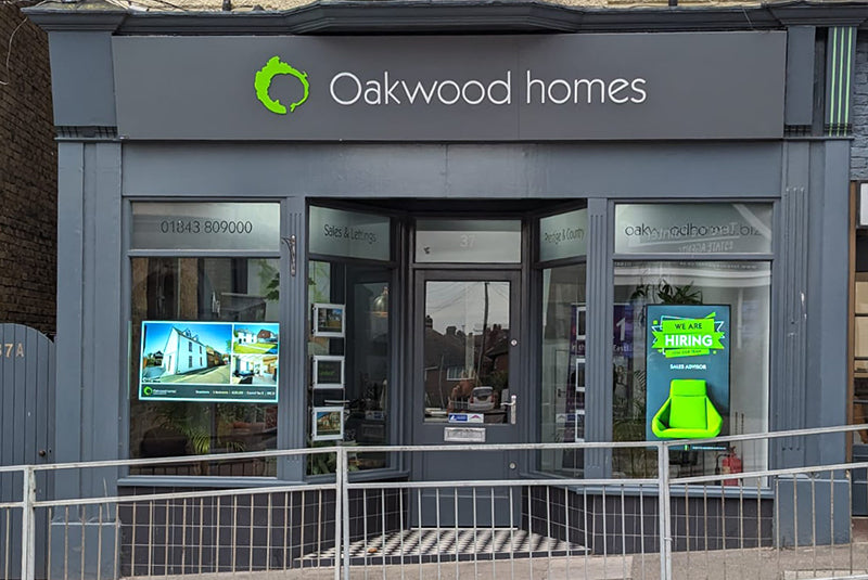 Add Vision Ultra High Brightness window display showing vibrant, illuminated signage for retail storefronts.