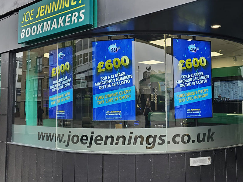 Add Vision Ultra High Brightness Window Display showing vibrant illuminated signage in a retail setting.